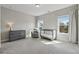 Cozy Bedroom with soft carpeting, ample natural light, and neutral color scheme at 214 Leland Way, Woodstock, GA 30188