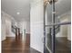 Elegant foyer featuring hardwood floors, staircase, and wainscoting, viewed through the front door at 214 Leland Way, Woodstock, GA 30188