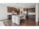 Modern kitchen with stainless steel appliances, granite countertops, and a large island at 214 Leland Way, Woodstock, GA 30188