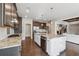 Modern kitchen features a large island with seating and opens to the living room at 214 Leland Way, Woodstock, GA 30188