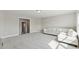 Large living room with gray walls, plush carpets, and a plush sectional sofa at 214 Leland Way, Woodstock, GA 30188