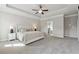 Bright main bedroom with tray ceiling, neutral color palette, and en-suite bath access at 214 Leland Way, Woodstock, GA 30188