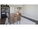 Office space with a modern desk, shelves, dark floors and french doors to other rooms at 214 Leland Way, Woodstock, GA 30188