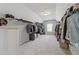 Spacious walk-in closet with ample storage and organization options for clothes at 214 Leland Way, Woodstock, GA 30188