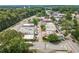 Aerial view of commercial real estate properties on a street, featuring business and roads at 402 Chattahoochee St, Roswell, GA 30075