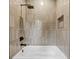 Modern bathroom features a sleek shower with a rainfall showerhead and stylish vertical tiling at 402 Chattahoochee St, Roswell, GA 30075