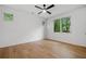 Spacious bedroom featuring hardwood floors, a ceiling fan, and large windows at 402 Chattahoochee St, Roswell, GA 30075