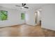 Spacious bedroom boasts hardwood floors, ample natural light, and a ceiling fan at 402 Chattahoochee St, Roswell, GA 30075