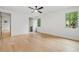 Bright bedroom with hardwood floors and large windows providing natural light at 402 Chattahoochee St, Roswell, GA 30075