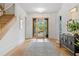 Elegant foyer with a grand staircase, hardwood floors, and stylish furnishings at 402 Chattahoochee St, Roswell, GA 30075