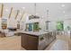 Open floor plan showcasing modern kitchen with island, flowing into the living and dining areas at 402 Chattahoochee St, Roswell, GA 30075