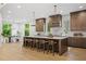 Open concept kitchen with large island, counter seating, and stainless steel appliances at 402 Chattahoochee St, Roswell, GA 30075