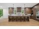 Modern kitchen featuring large island with seating, tile backsplash, and stainless steel appliances at 402 Chattahoochee St, Roswell, GA 30075