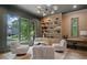 Stylish living room with built-in shelves, comfortable seating, and large windows overlooking the yard at 402 Chattahoochee St, Roswell, GA 30075