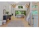 Bright living room with vaulted ceilings, wooden beams, and a view to the greenery outside at 402 Chattahoochee St, Roswell, GA 30075