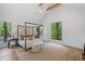 Spacious main bedroom features canopy bed, large windows, and vaulted ceilings at 402 Chattahoochee St, Roswell, GA 30075