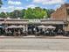 Exterior of Zest Restaurant with outdoor seating area and an inviting atmosphere, perfect for dining at 402 Chattahoochee St, Roswell, GA 30075