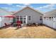 Cozy backyard with white fence, patio seating and umbrella for outdoor entertaining at 510 Riverview Ln, Canton, GA 30114