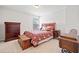 This bedroom features hardwood furniture, carpeted floors, and neutral paint at 510 Riverview Ln, Canton, GA 30114