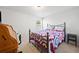 This bedroom features carpeted floors, a bed, and neutral colored walls at 510 Riverview Ln, Canton, GA 30114