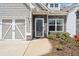Close up of house exterior with stylish front door and a well manicured landscaped flower bed at 510 Riverview Ln, Canton, GA 30114