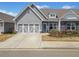 Charming home with a two-car garage, stone accents, and a well-maintained front yard at 510 Riverview Ln, Canton, GA 30114