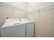 This laundry room features shelving and a washer and dryer at 510 Riverview Ln, Canton, GA 30114