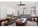 Bright living room with comfortable seating, wood floors, ceiling fan, and lots of natural light at 510 Riverview Ln, Canton, GA 30114