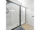 This modern shower features a sliding glass door, and tiled walls at 510 Riverview Ln, Canton, GA 30114