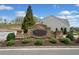 Stone community sign with beautiful landscaping entrance to The Villages at River Pointe at 510 Riverview Ln, Canton, GA 30114