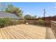 Overhead view of a wood deck with railing overlooking the yard's greenery at 218 Ridley Ln, Decatur, GA 30030