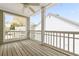 Back porch features a ceiling fan, wooden floors, and backyard views at 218 Ridley Ln, Decatur, GA 30030