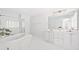 Luxurious bathroom features double sinks, a glass shower, and a jacuzzi tub at 218 Ridley Ln, Decatur, GA 30030