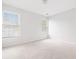 Bright, empty bedroom featuring carpet, white walls, and natural light at 218 Ridley Ln, Decatur, GA 30030