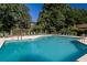 Community pool surrounded by lounge chairs and a well-manicured lawn at 218 Ridley Ln, Decatur, GA 30030