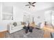 Well-lit living room featuring hardwood floors, a stylish area rug, and comfortable seating, ideal for relaxation at 218 Ridley Ln, Decatur, GA 30030