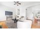 Spacious living room with hardwood floors, a modern fireplace, and open layout perfect for entertaining and relaxation at 218 Ridley Ln, Decatur, GA 30030