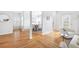 Open-concept living area leading to a dining space, featuring hardwood floors and neutral decor with lots of natural light at 218 Ridley Ln, Decatur, GA 30030