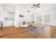 Open living space connecting to a kitchen area, featuring hardwood floors, lots of natural light, and a modern design at 218 Ridley Ln, Decatur, GA 30030