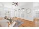 Inviting sitting room featuring hardwood floors, neutral decor, and large windows providing ample natural light at 218 Ridley Ln, Decatur, GA 30030