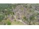 Aerial view of estate on wooded lot with winding driveway at 3341 Camelot Way, Loganville, GA 30052