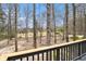 Private wooden deck offers peaceful views of the backyard and surrounding woods at 3341 Camelot Way, Loganville, GA 30052