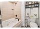 Bathroom featuring a jacuzzi tub and tiled shower, with stylish accents at 3341 Camelot Way, Loganville, GA 30052