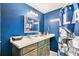 Sports themed bathroom with unique decorations and a stylish vanity at 3341 Camelot Way, Loganville, GA 30052