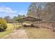 Open carport structure perfect for storing equipment and toys on the property at 3341 Camelot Way, Loganville, GA 30052