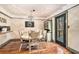 Elegant dining room with a classic chandelier and scenic backyard views at 3341 Camelot Way, Loganville, GA 30052