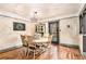 Cozy dining room with wooden floors and backyard views at 3341 Camelot Way, Loganville, GA 30052