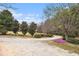 Charming circle driveway surrounded by mature landscaping and trees at 3341 Camelot Way, Loganville, GA 30052