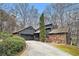 Charming exterior of a two-story home featuring a stone accent wall and well-maintained landscaping at 3341 Camelot Way, Loganville, GA 30052