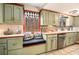 Bright kitchen features a breakfast nook, stone backsplash and ample counter space at 3341 Camelot Way, Loganville, GA 30052